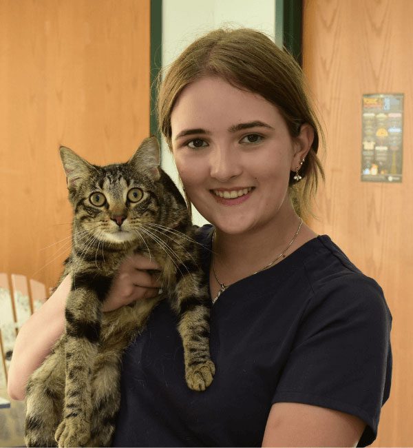 Brooke holding a tabby cat