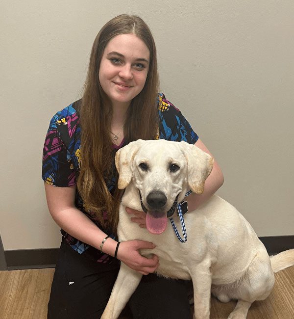 Danielle with a white lab