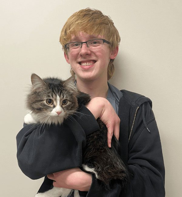 Eddie holding a fluffy cat